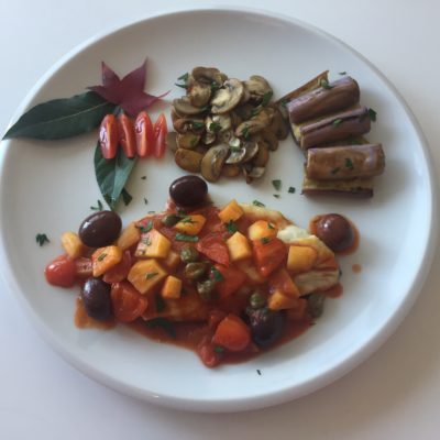 Filetto di branzino in salsa mediterranea