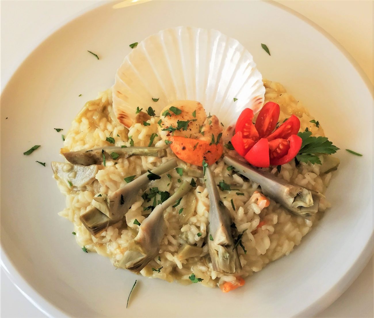 Risotto con cappesante e cuori di carciofo