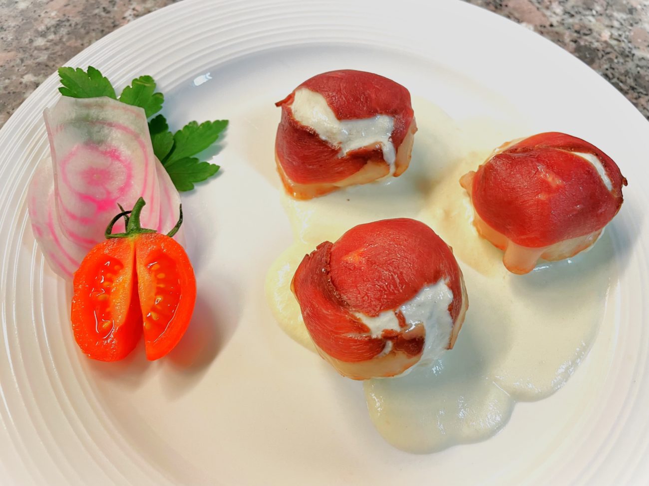Gnocchi ripieni di montasio con salsa di latteria stravecchio